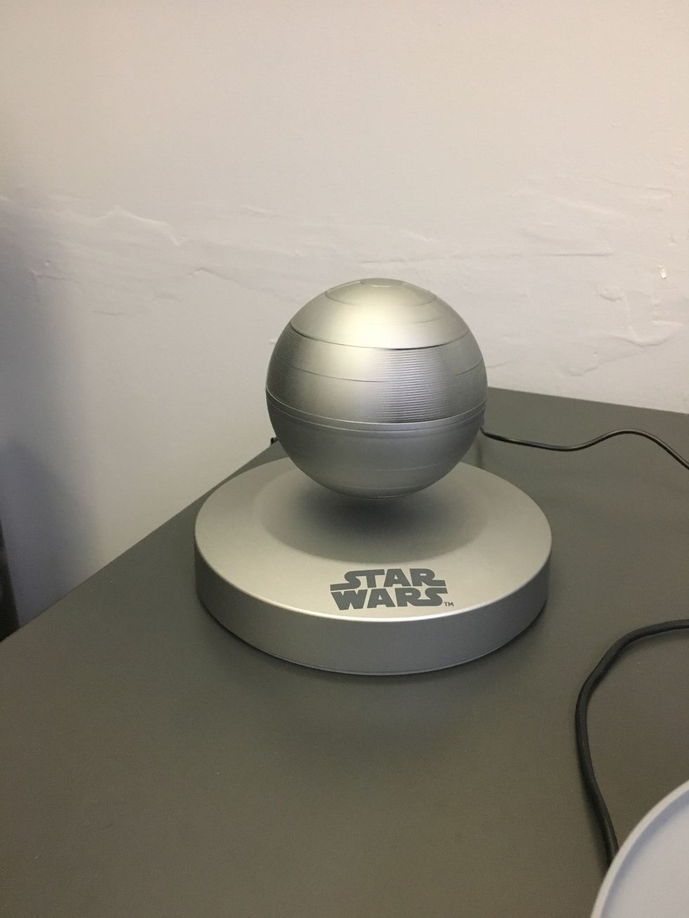 The Death Star Bluetooth Speaker on a table top