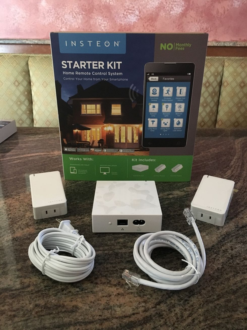 A\u00a0photo of Insteon Starter Kit unboxed on a countertop