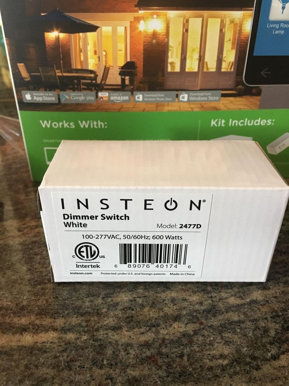 A photo of Insteon Dimmer Switch box on a countertop