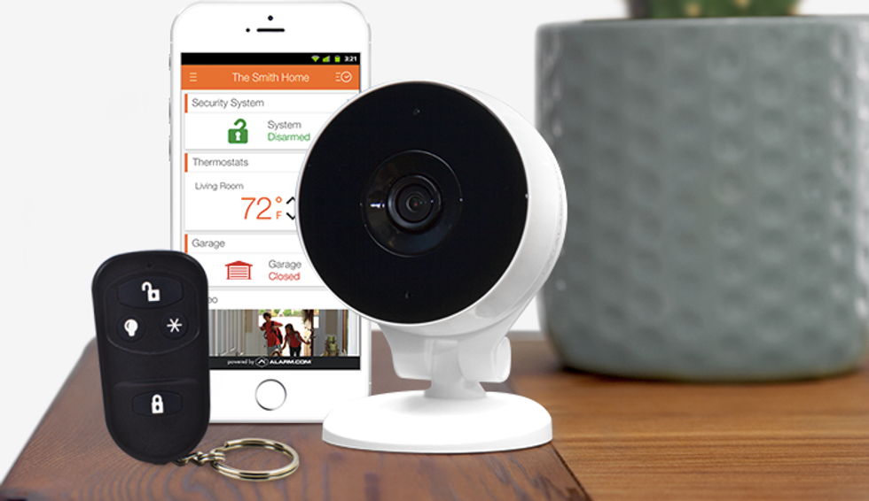 a photo of Protect America's keyfob, security camera and a smartphone with their app