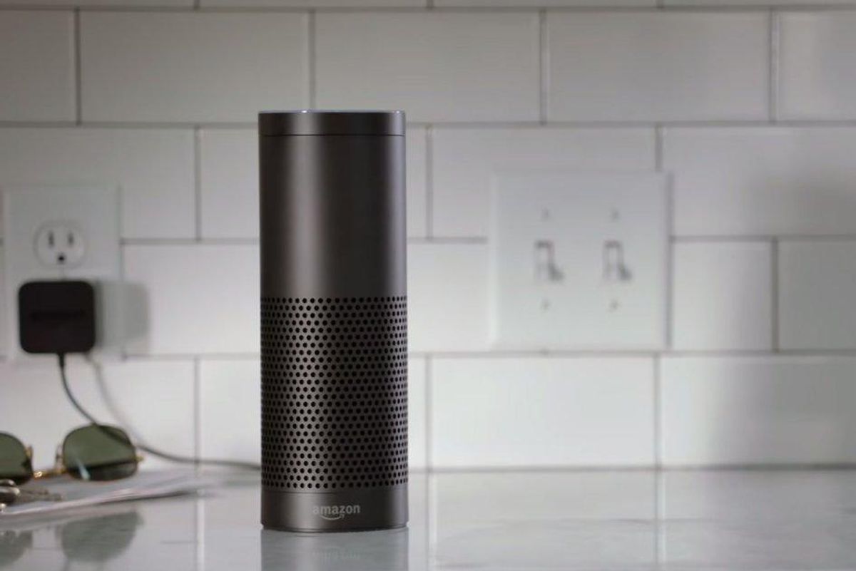 a photo of Amazon Echo 1st Gen speaker on a kitchen counter