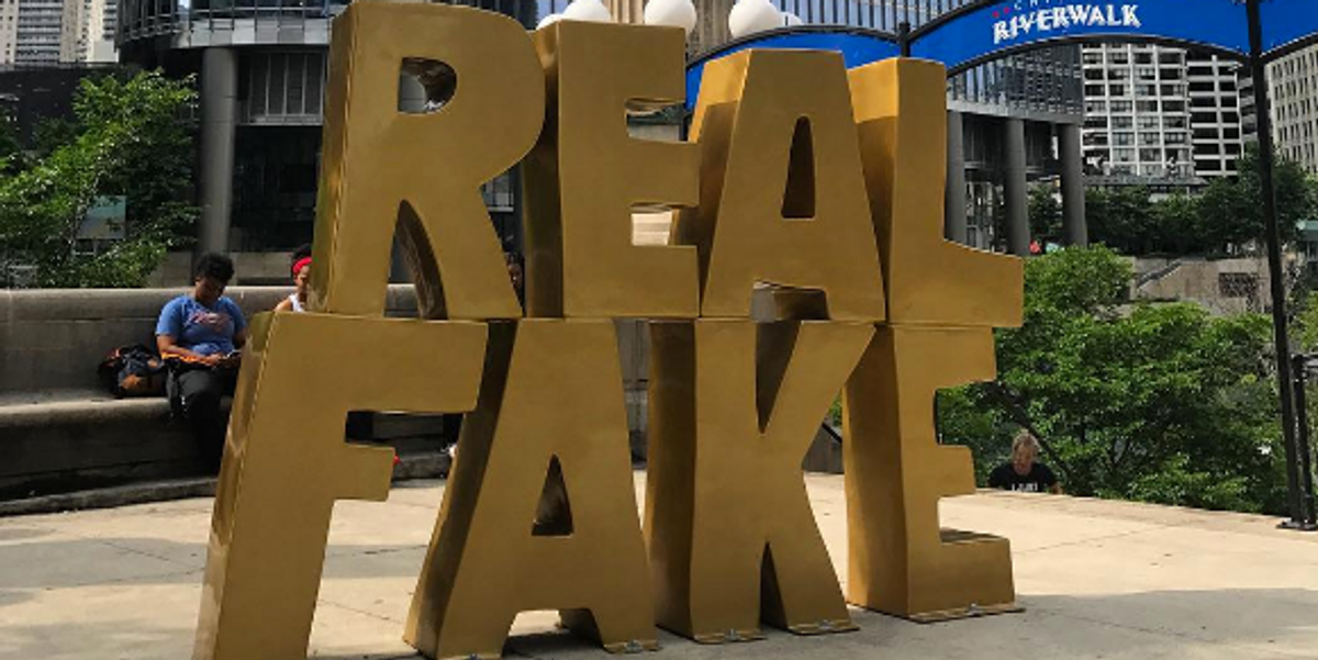 There is Now a Gold, Gleaming 'Real Fake' Statue Outside Chicago's Trump Tower