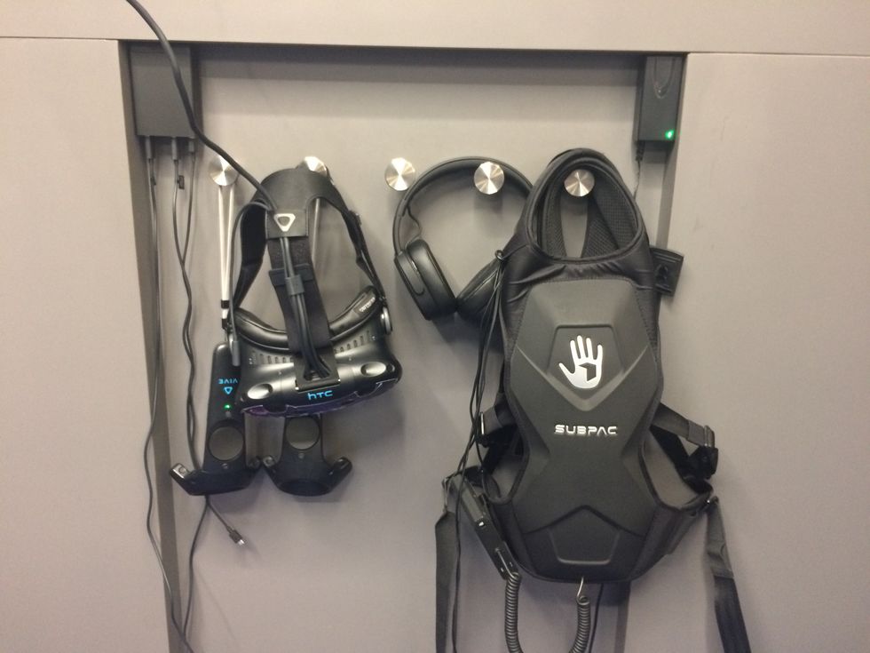 vr headsts hanging on the wall photo