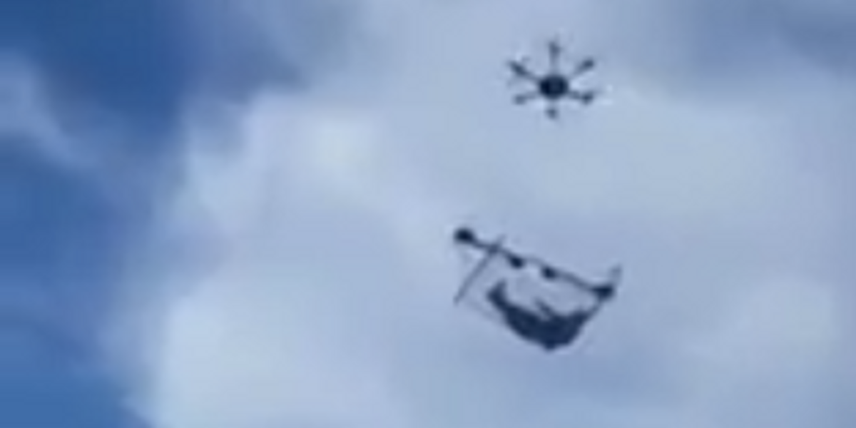 May We All Be as Carefree as This Man Flying Around Town in a Drone-Suspended Hammock