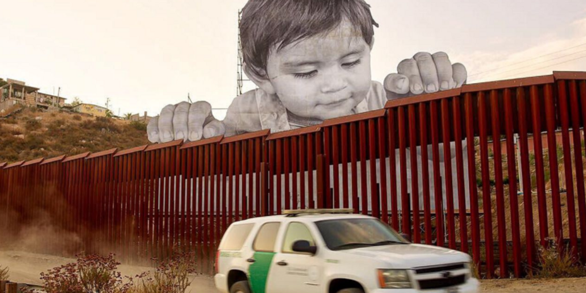 Giant Baby Mural Placed at U.S.-Mexico Border Wall