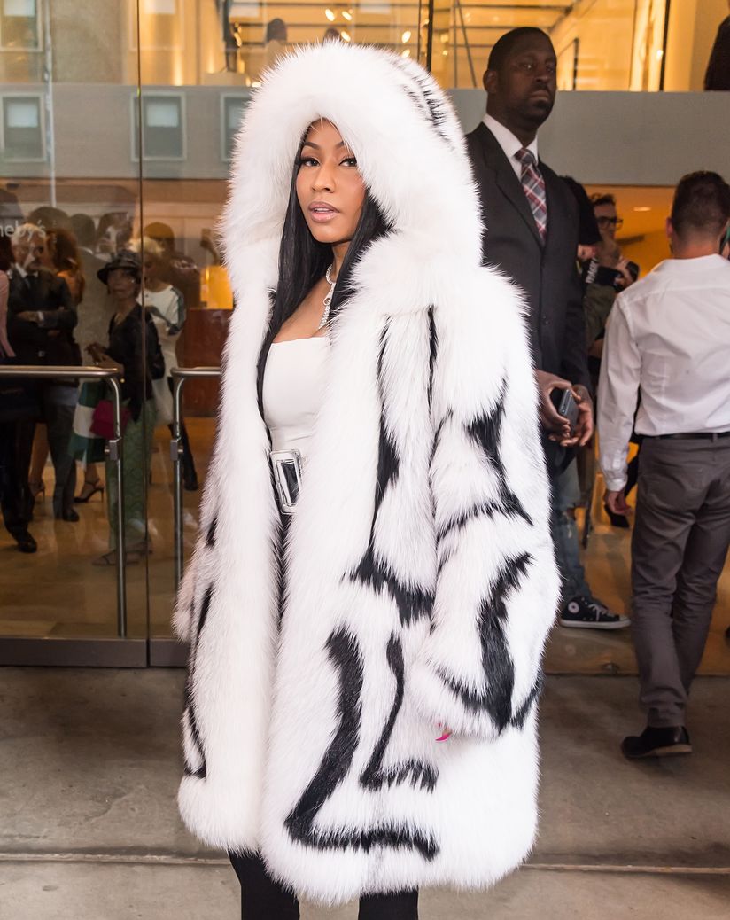 Nicki Minaj sizzles in a fur coat during 76-degree heat