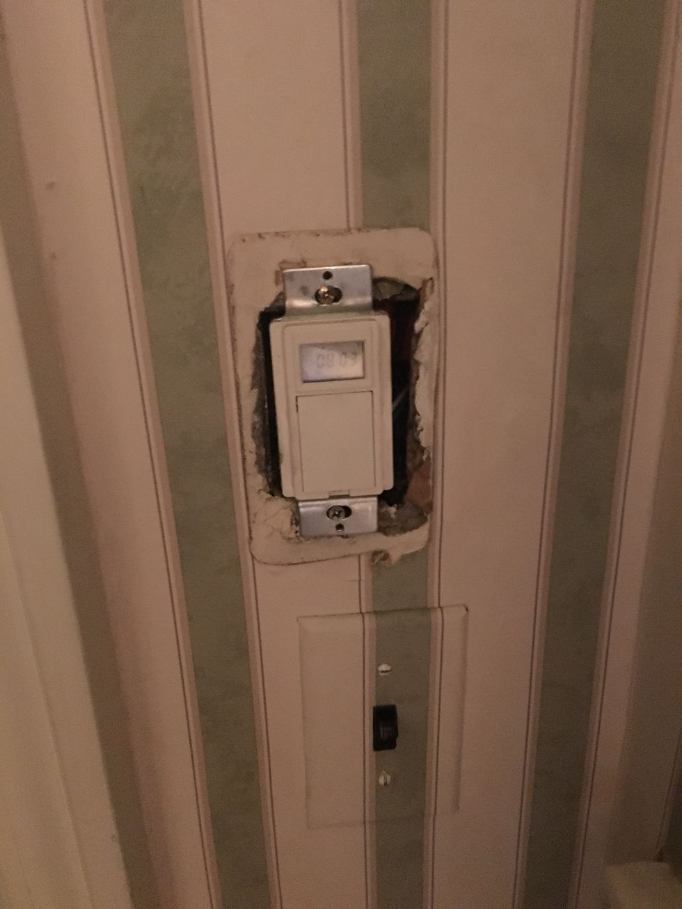 a photo of a smart light switch on the wall