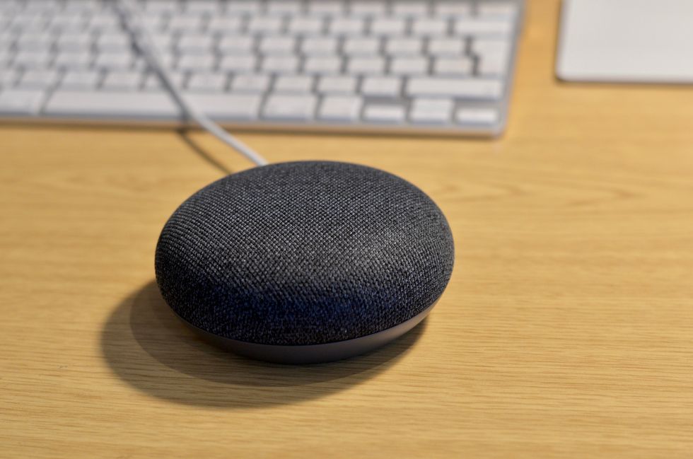 Picture of Google Home Mini on a desktop.