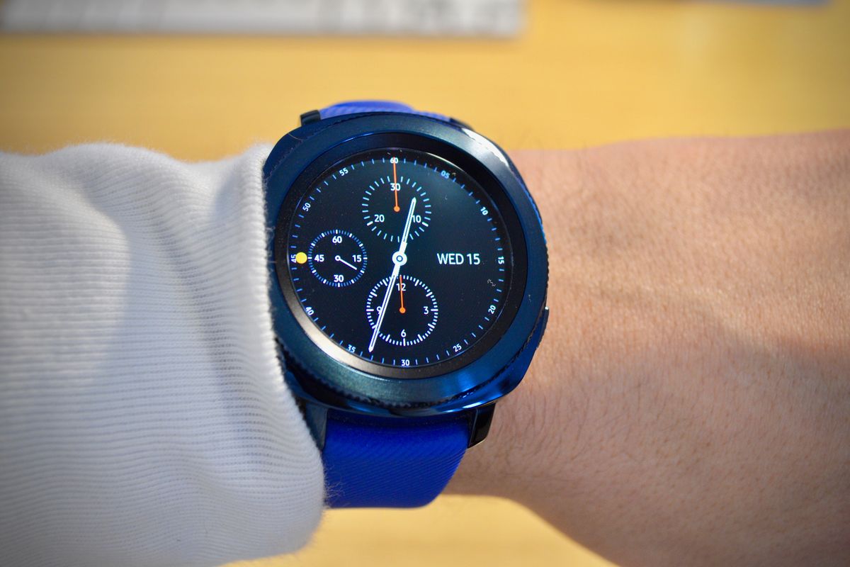 a photo of Samsung Gear Sport on man's wrist