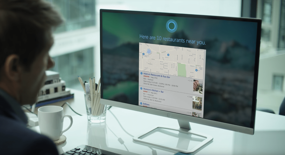 a man on a computer looking at map