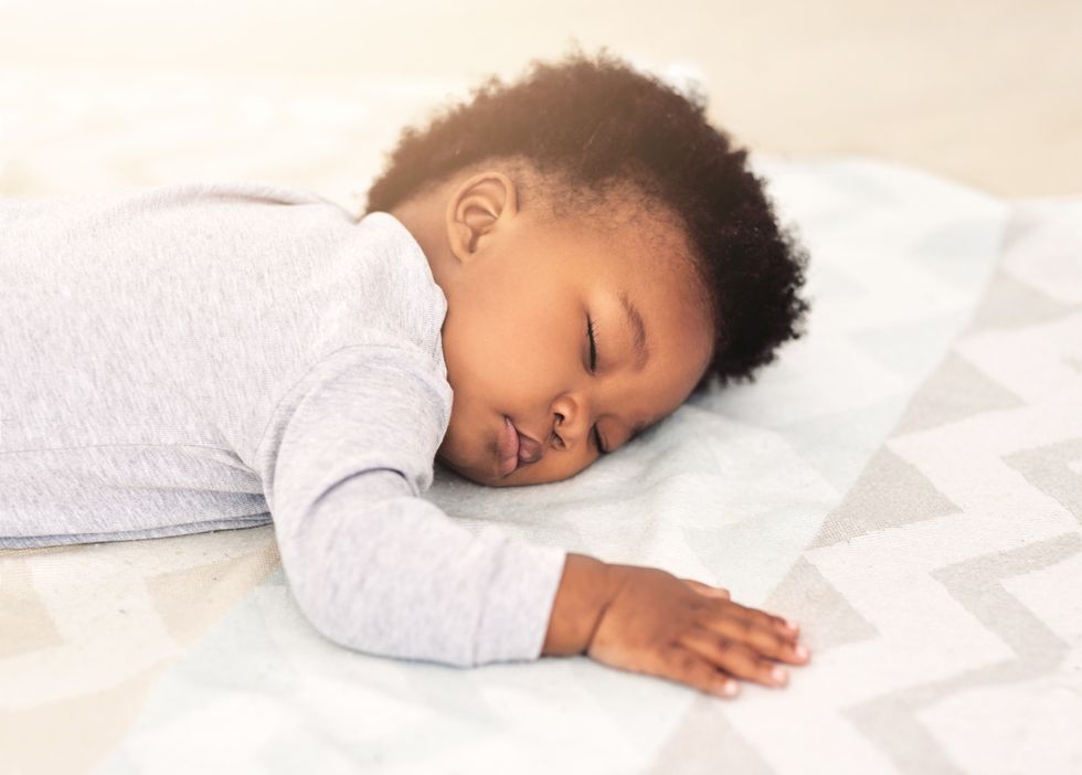 Baby sleeping in crib and Alexa skill to help baby sleep.