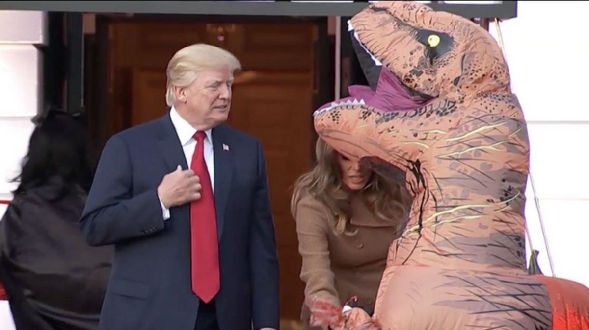 WATCH: Trump has Awkward Encounter With Trick-or-Treating Dinosaur