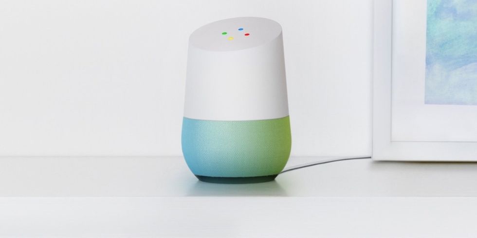 Picture of Google Home with Google Assistant on a shelf.