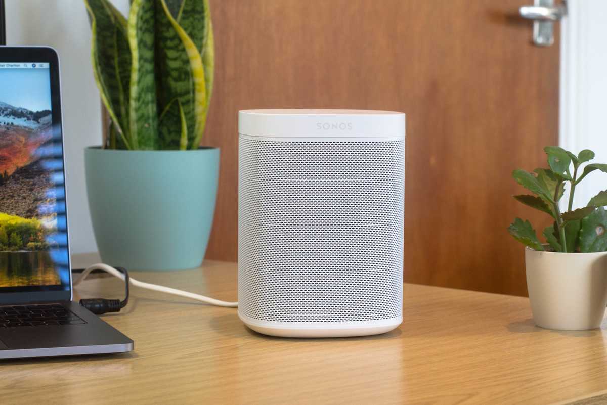 A photo of Sonos One on a desk top.