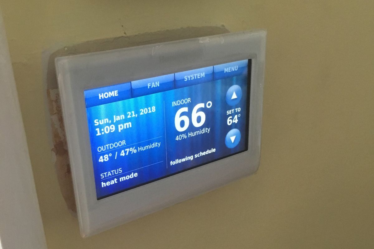 Honeywell Home Color Wi-Fi Smart Thermostat on the wall.
