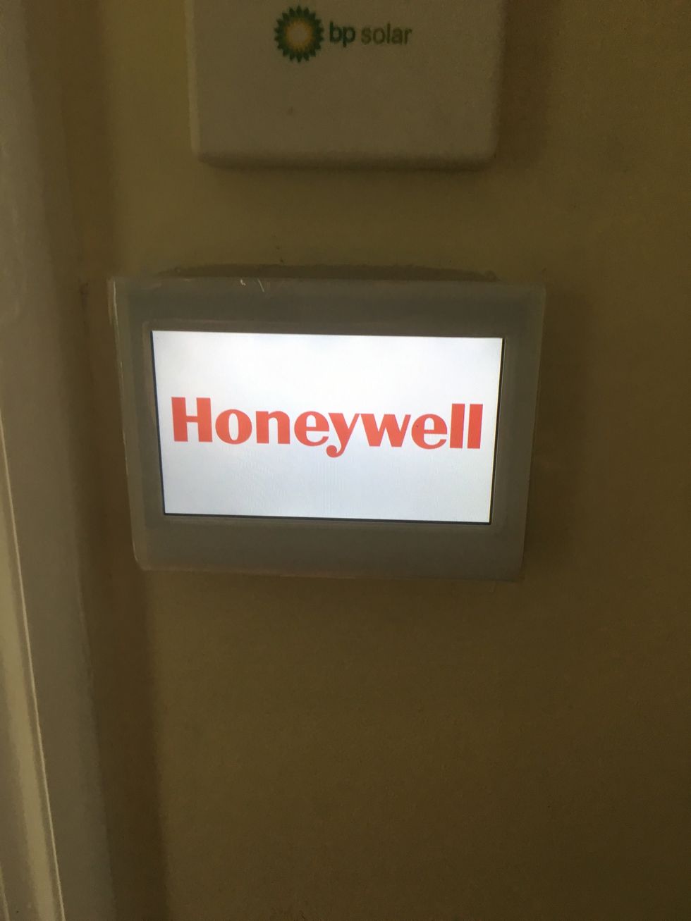 a photo of honeywell wifi thermostat on a wall