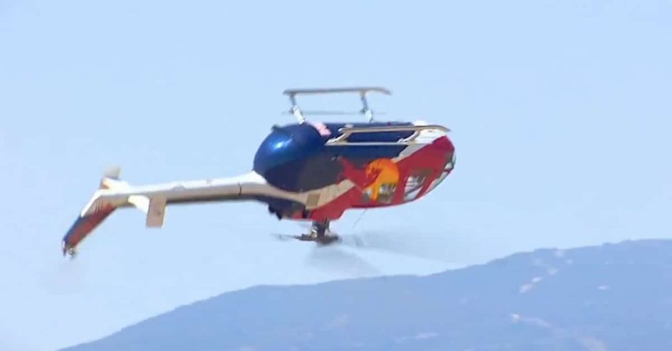 Watch this amazing stunt pilot fly a helicopter upsidedown Americas