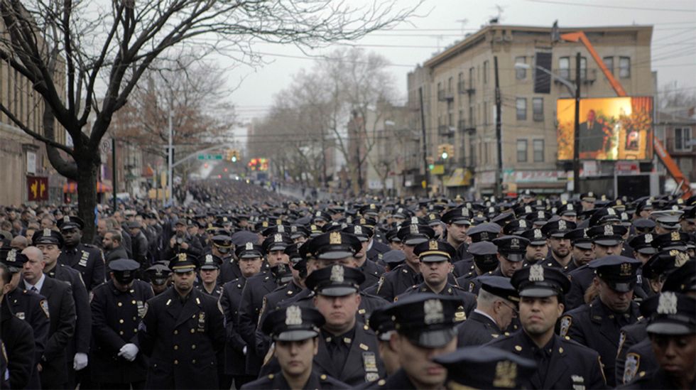 NYPD Cop Peeved At Reporter Disrespectfully Covering Cops' Solemn, Funereal Disrespect