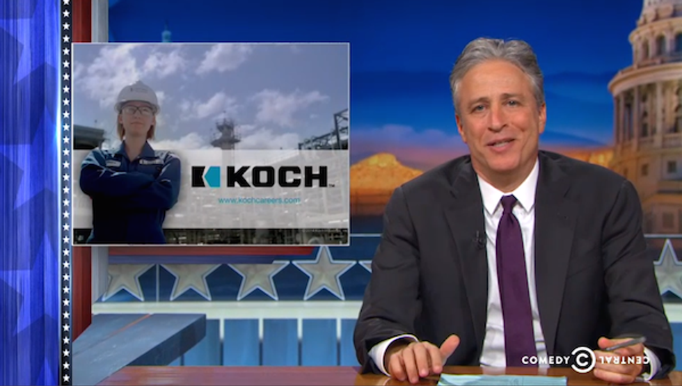 Jon Stewart Literally Eviscerates The Koch Brothers, Through A Window