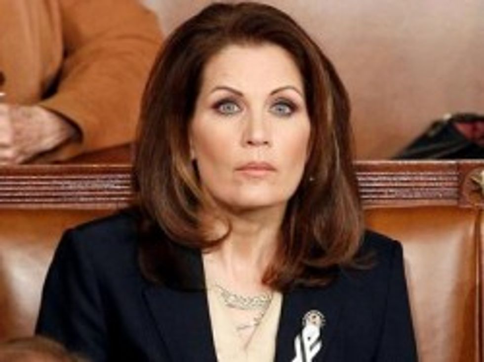 Evil College Kids Force Bachmann Into Hiding With Funny Signs