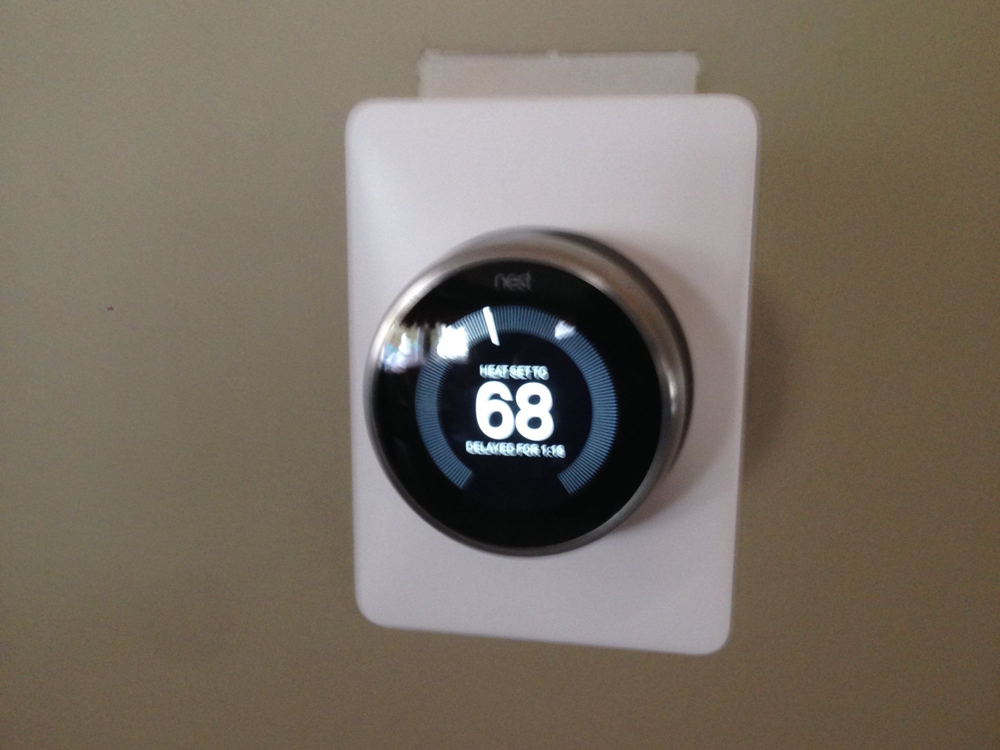 a photo of a Nest Thermostat installed by a Vivint installer.
