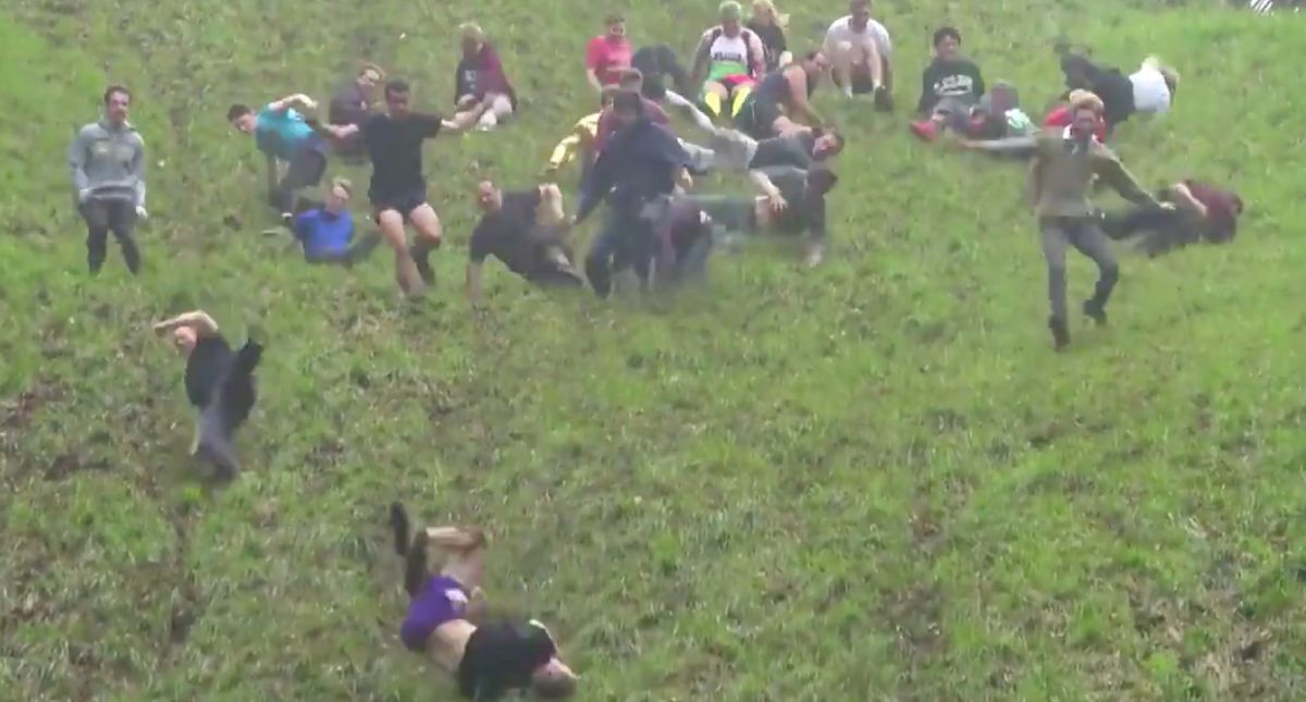 A Mass Of British People Just Chased A Wheel Of Cheese Down A Hill—And It Looks Painful 😖