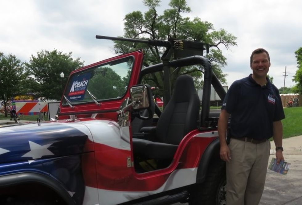 Kris Kobach Wants You To Suck On His Fake Machine Gun