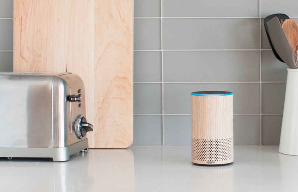 a photo of echo plus speaker on a kitchen counter