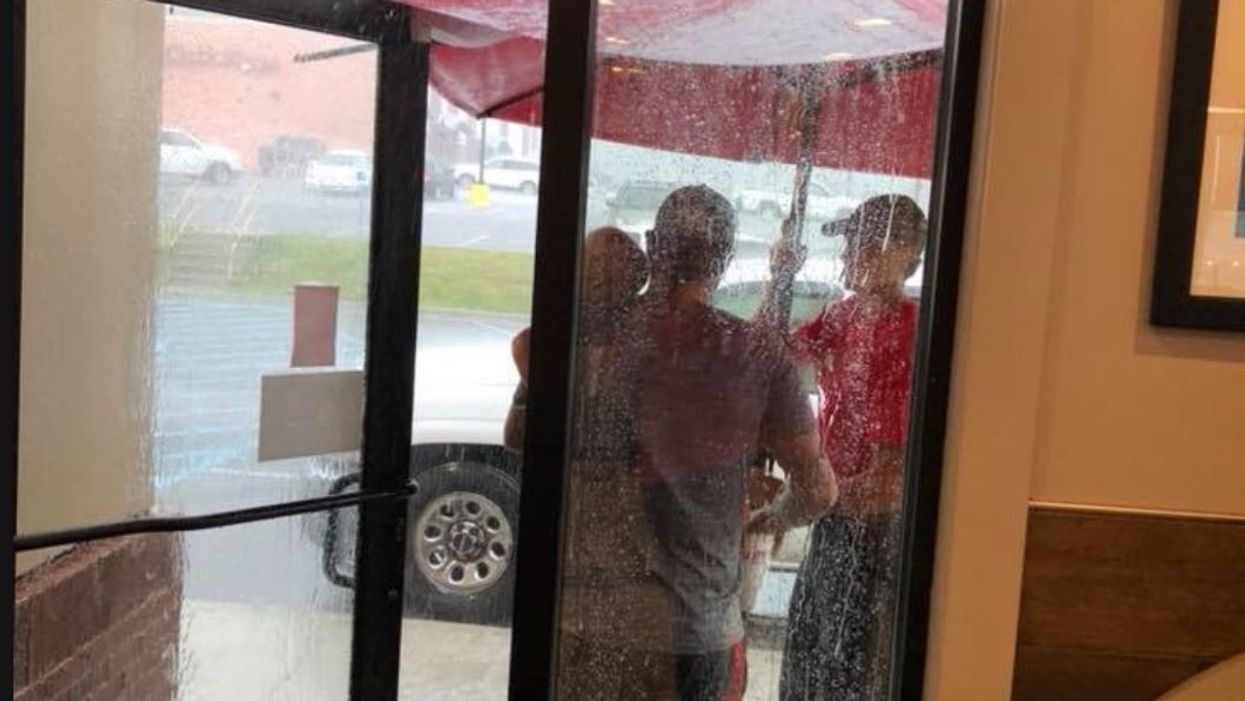 Alabama fast food worker shields customers from rain, is basically the hero we need right now