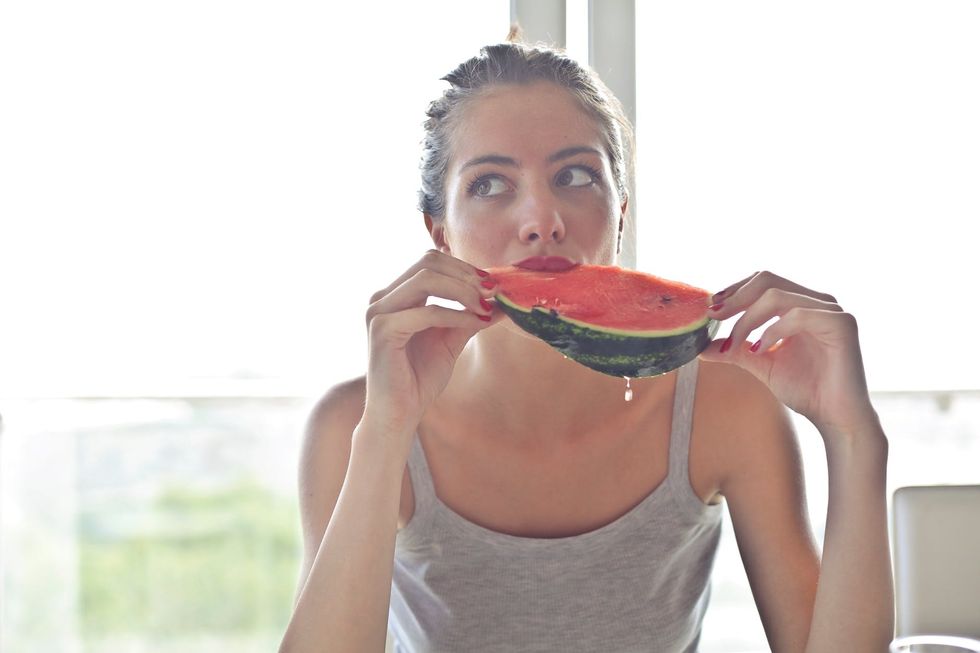 https://www.pexels.com/photo/woman-in-gray-tank-top-holding-watermelon-768454/