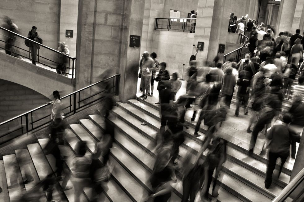 black, white, desaturated, long exposure, people, walking, stairs, busy, shadows