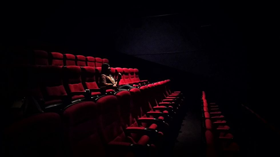 Woman Alone at Movie Theater