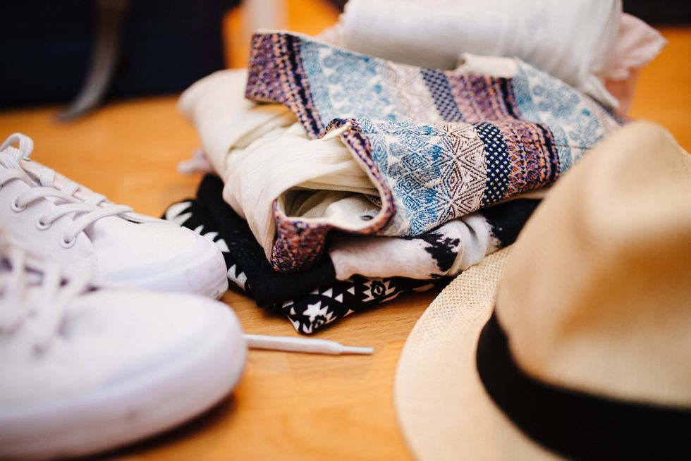 https://www.pexels.com/photo/brown-fedora-hat-beside-white-sneakers-and-blue-textile-8434/