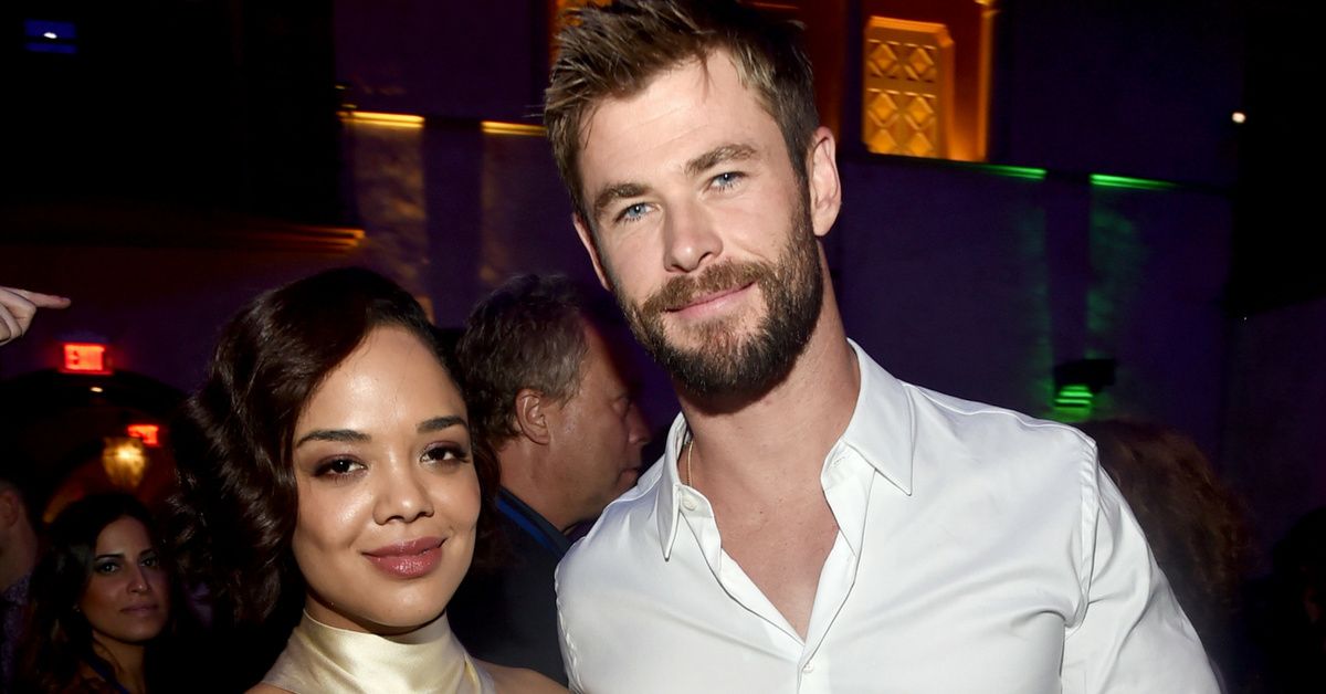 Chris Hemsworth And Tessa Thompson Look Dapper AF In Newly-Released 'Men In Black' Reboot Pics—And We're So Ready