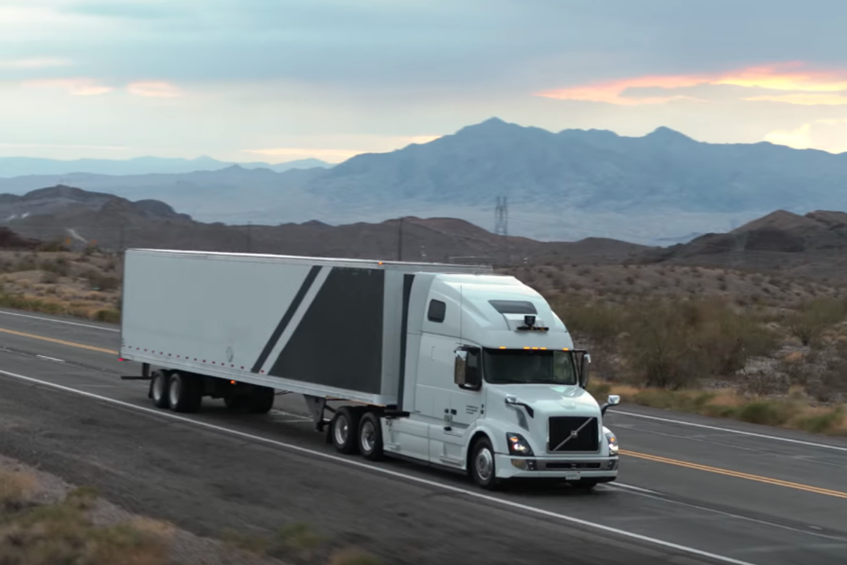 a photo of a self-driving truck driving on the road