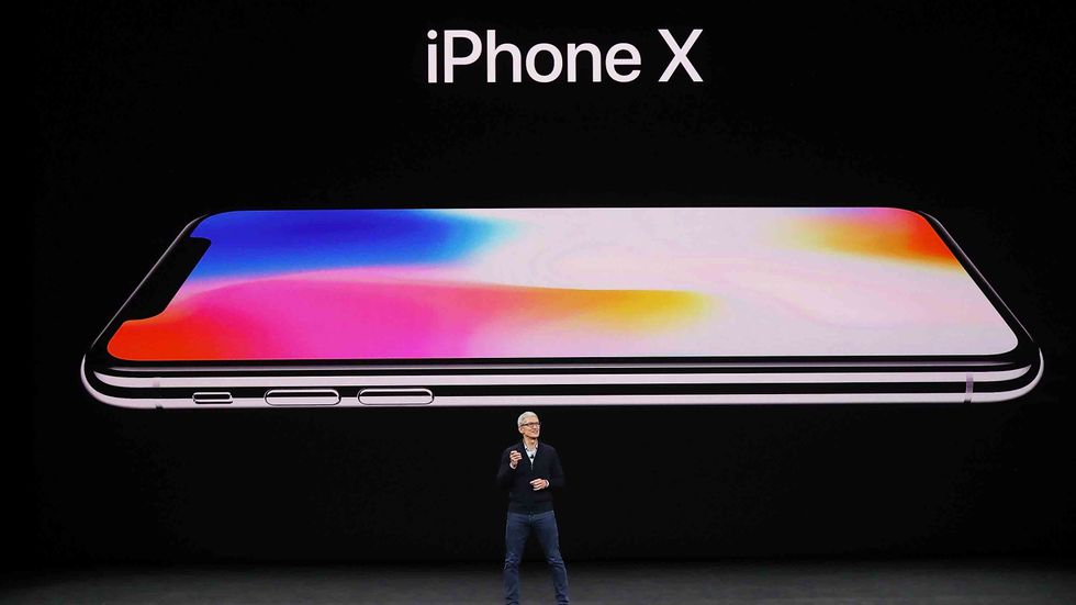 CUPERTINO, CA - SEPTEMBER 12: Apple CEO Tim Cook announces the new iPhone X during an Apple special event at the Steve Jobs Theatre on the Apple Park campus on September 12, 2017 in Cupertino, California. (Photo by Justin Sullivan/Getty Images)