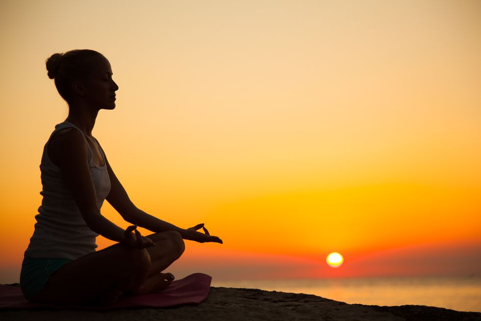 Meditating woman.