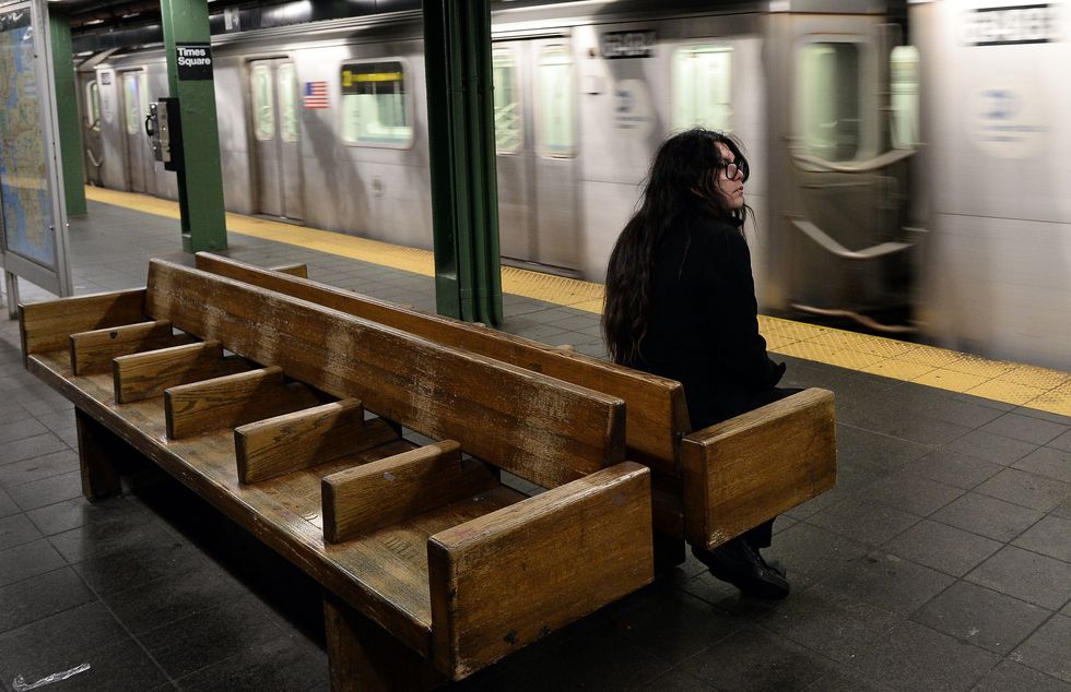 Lonely girl waiting for the subway.