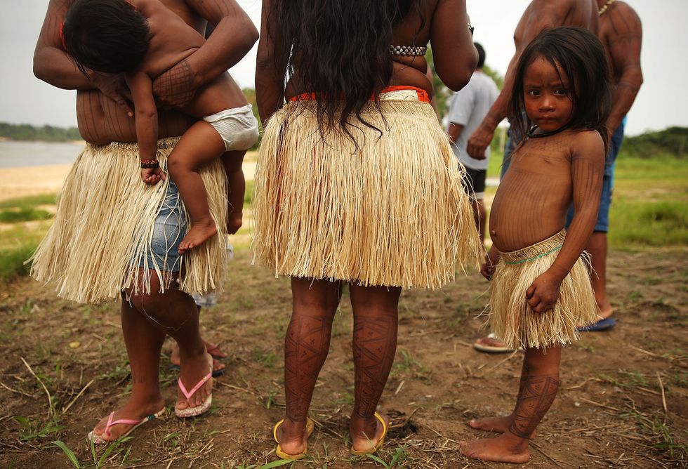 Little girl in a grass skirt.