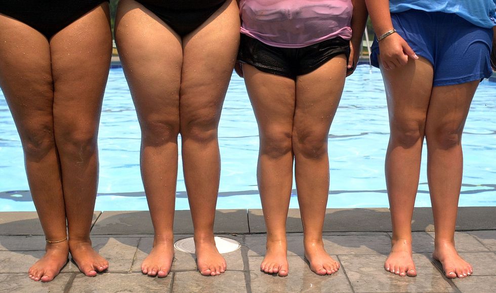 Kids standing outside the pool.