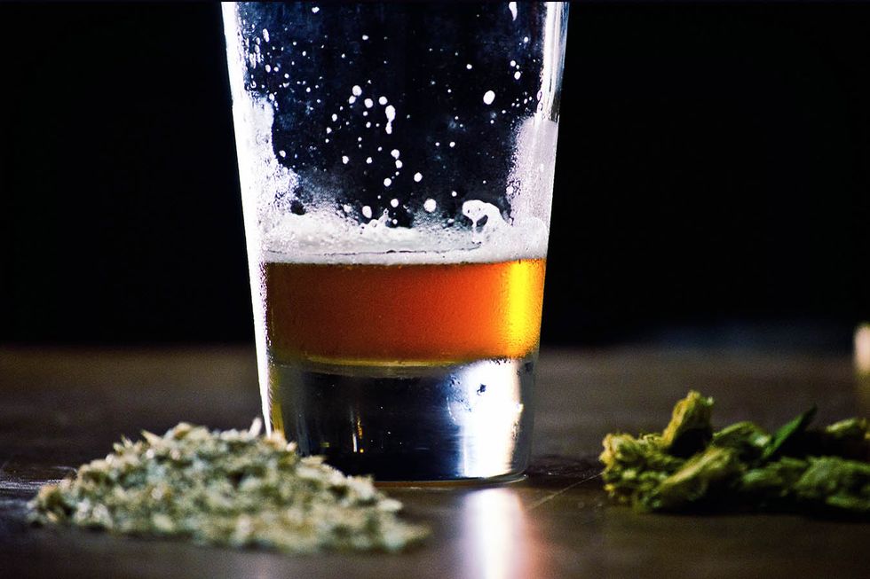 Close-Up Of Beer And Cannabis On Table (Getty Images)