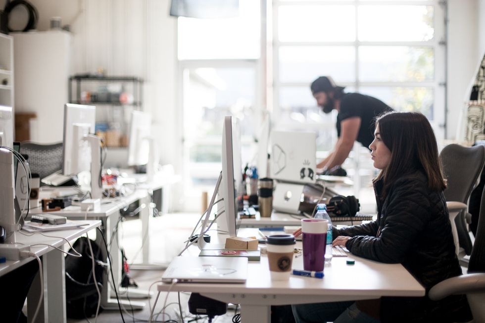 Two people in a modern office.