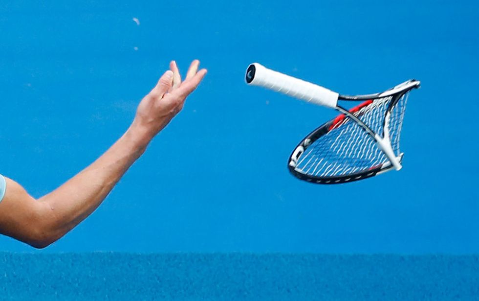 Alexander Zverev throws the racquet he smashed in frustration in the fifth set of his third-round match against Hyeon Chung of Korea on day six of the 2018 Australian Open at Melbourne Park. (Photo by Scott Barbour/Getty Images)