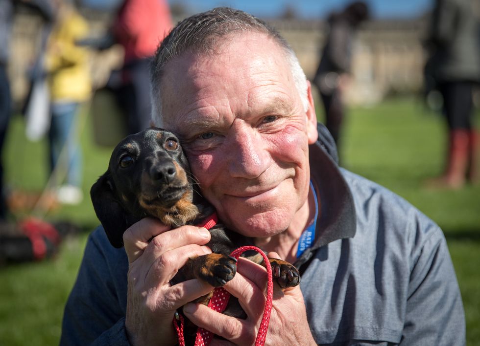 A man with his dog.