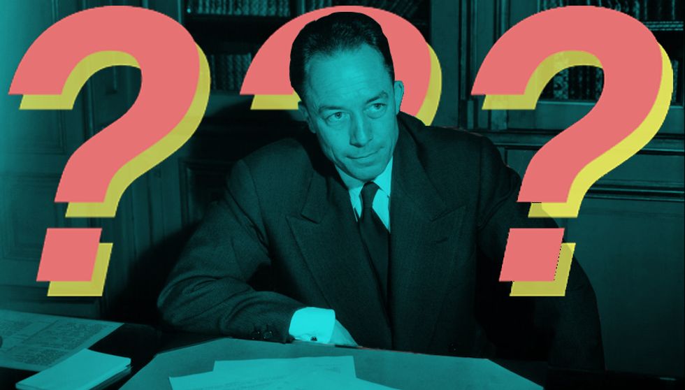 Albert Camus posing for a photograph after being told he won the Noel Prize for literature. (Getty Images)