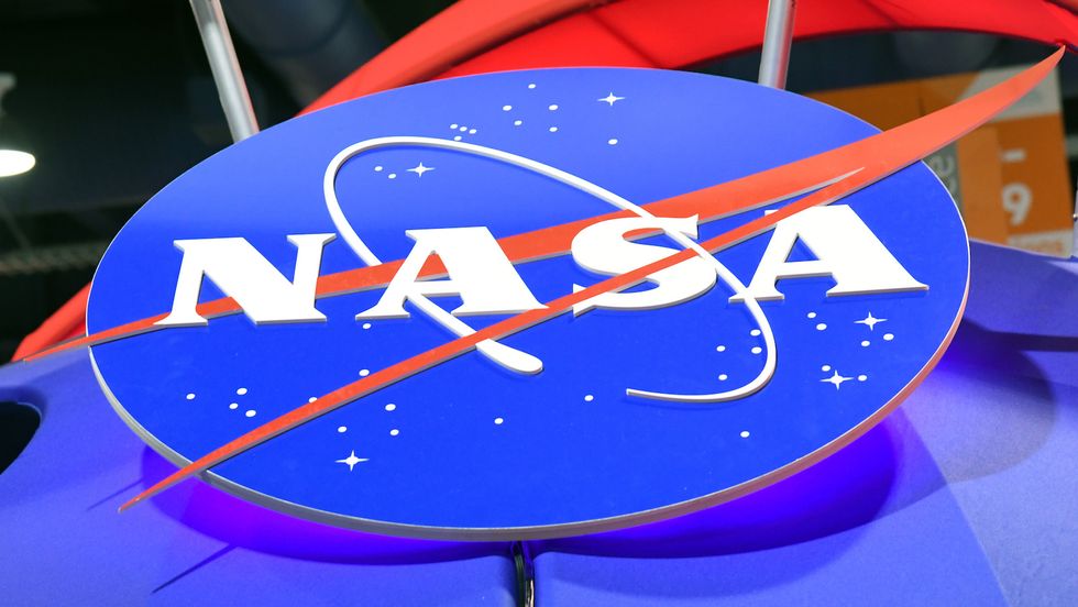 LAS VEGAS, NV - JANUARY 11: The NASA logo is displayed at the agency's booth during CES 2018 at the Las Vegas Convention Center on January 11, 2018 in Las Vegas, Nevada. CES, the world's largest annual consumer technology trade show, runs through January