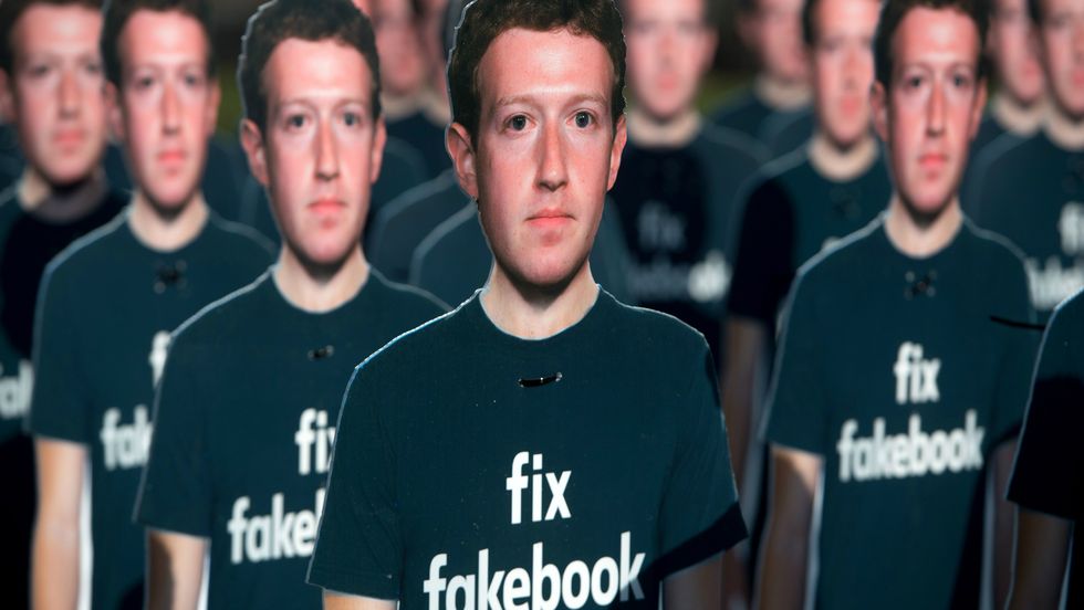One hundred cardboard cutouts of Facebook founder and CEO Mark Zuckerberg stand outside the US Capitol in Washington, DC, April 10, 2018. (Photo: Saul Loeb/Getty)