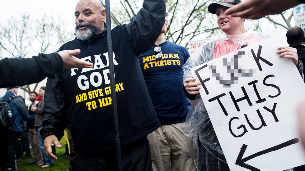 Atheists and non-atheists talk during the Reason Rally on the National Mall March 24, 2012 in Washington, DC. (Photo: BRENDAN SMIALOWSKI/AFP/GettyImages)