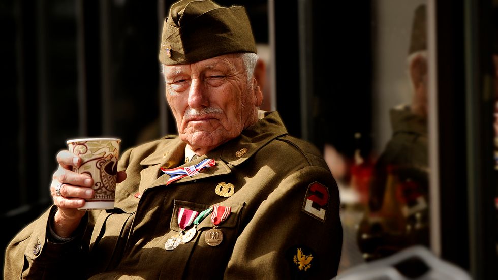 U.S. Army retired Sgt. Maj. Verldon Spence sits and drinks a cup of coffee after a Veterans Day Parade, Nov. 12, 2012. (Credit: Staff Sgt. Kenny Holston)