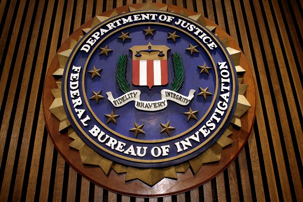 The seal of the F.B.I. hangs in the Flag Room at the bureau's headquaters March 9, 2007 in Washington, DC. (Chip Somodevilla/Getty Images))